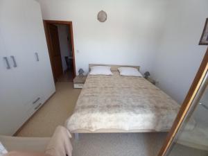 Postel nebo postele na pokoji v ubytování Apartmani Grzelj-Skledar