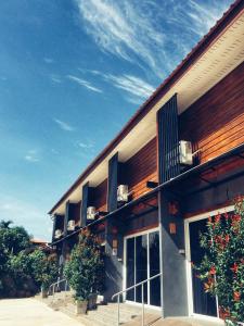 a building with balconies on the side of it at Boutique Family Room Phitsanulok in Phitsanulok