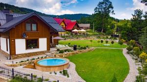 an estate with a pool in the yard at Willa Mariza Szczawnica Jaworki in Szczawnica