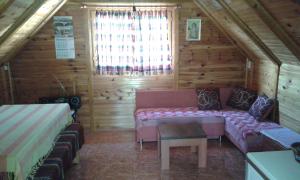 Postel nebo postele na pokoji v ubytování Brvnara Lug, apartman