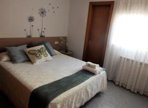 Кровать или кровати в номере Cal Carinyo, allotjament familiar