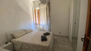 Postel nebo postele na pokoji v ubytování CASAMIELI, Nuovo, vicino al porto al mare e al centro + 31 fotografií