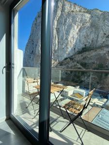 a room with a view of a mountain through a window at CP Top floor luxury studio in Gibraltar