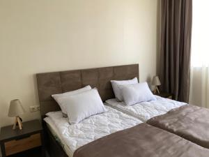 Postel nebo postele na pokoji v ubytování Horizons Hotel Rooms