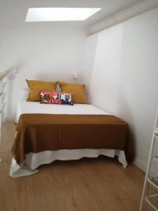 Voodi või voodid majutusasutuse Tiny House Faro toas