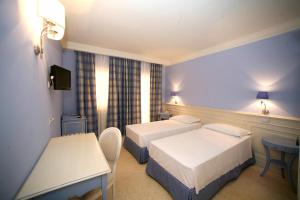 Postel nebo postele na pokoji v ubytování Palace Hotel Vieste