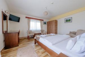 Postel nebo postele na pokoji v ubytování Hotel Zlatni bor