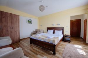 Postel nebo postele na pokoji v ubytování Hotel Zlatni bor