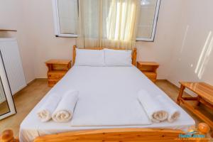 Posteľ alebo postele v izbe v ubytovaní Hotel Arion