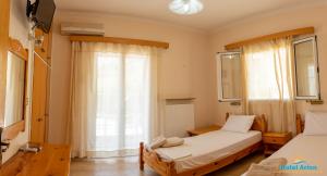 Posteľ alebo postele v izbe v ubytovaní Hotel Arion