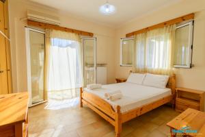 Posteľ alebo postele v izbe v ubytovaní Hotel Arion