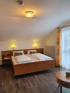 Postel nebo postele na pokoji v ubytování Kurhotel Anders