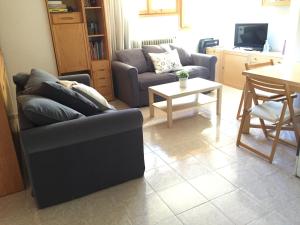 Posezení v ubytování Atico en Biescas con Piscina, Tenis y Barbacoa