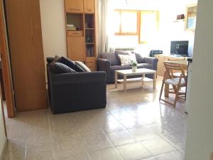 Posezení v ubytování Atico en Biescas con Piscina, Tenis y Barbacoa