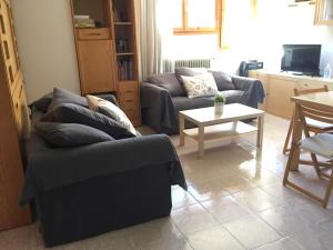 Posezení v ubytování Atico en Biescas con Piscina, Tenis y Barbacoa