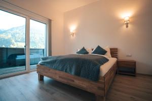 Postel nebo postele na pokoji v ubytování Landart-Appartements