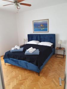 Postel nebo postele na pokoji v ubytování Apartments Perina