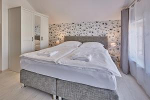 Posteľ alebo postele v izbe v ubytovaní Apartmány Malen