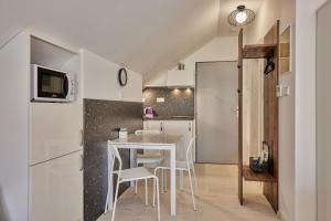 Kuchyňa alebo kuchynka v ubytovaní Apartmány Malen