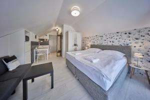 Posteľ alebo postele v izbe v ubytovaní Apartmány Malen