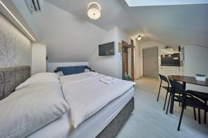 Posteľ alebo postele v izbe v ubytovaní Apartmány Malen