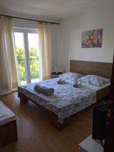 Postel nebo postele na pokoji v ubytování Apartment Fugosic