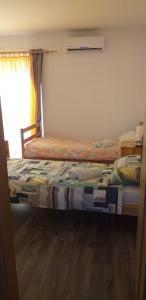 Postel nebo postele na pokoji v ubytování Relax in Črni Kal 2