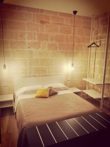 A bed or beds in a room at Casa Patà