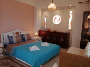 A bed or beds in a room at Prime Luxury Villa beach front