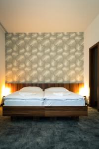 Posteľ alebo postele v izbe v ubytovaní Hotel Ring