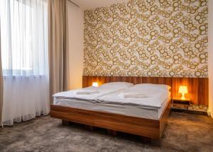 Posteľ alebo postele v izbe v ubytovaní Hotel Ring + 37 fotografií