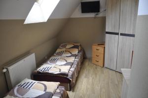 Łóżko lub łóżka w pokoju w obiekcie Pokoje na wynajem Gdańsk