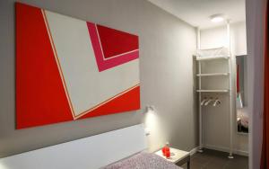 Postel nebo postele na pokoji v ubytování B&B WarmUp Grosseto - Parcheggio incluso nella corte interna