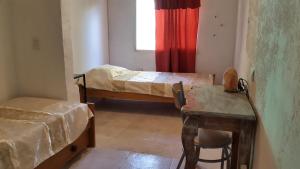 Ένα ή περισσότερα κρεβάτια σε δωμάτιο στο Puerta al arroyo