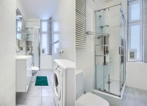 a bathroom with a toilet and a glass shower at Apartament Mesa - NoclegiSopot in Sopot