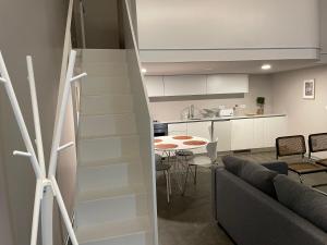 a living room with a couch and a table at Welcome inn Viseu in Viseu