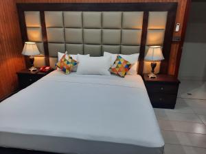 Krevet ili kreveti u jedinici u objektu Royal Motel Executive
