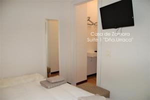 A bed or beds in a room at La Casa de Zamora