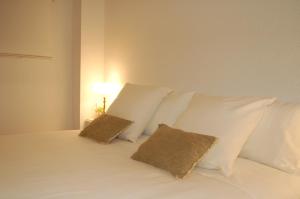 A bed or beds in a room at La Casa de Zamora