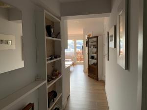 a hallway with a door leading to a room with a view at Residencial Sanz-Enea a 100m de la playa in Zarautz