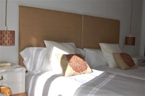 A bed or beds in a room at La Casa de Zamora