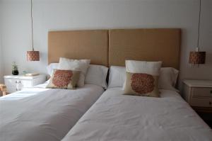 A bed or beds in a room at La Casa de Zamora