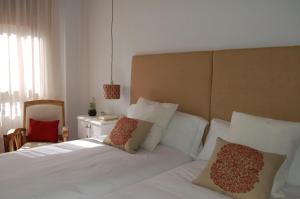 A bed or beds in a room at La Casa de Zamora