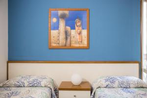 Postel nebo postele na pokoji v ubytování Hotel Clelia