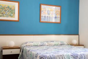Postel nebo postele na pokoji v ubytování Hotel Clelia