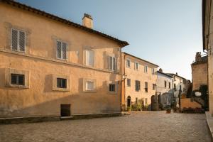 an empty street in an old town with buildings at Opera Suites - Le mille e una notte in Calcata
