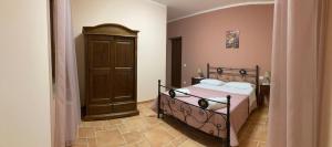 A bed or beds in a room at Agriturismo Tenuta della Madama