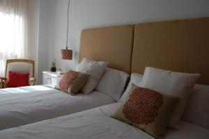 A bed or beds in a room at La Casa de Zamora