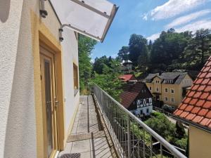 a balcony with a view of a town at Villa Sonnenblick in Kurort Rathen
