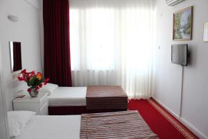Postel nebo postele na pokoji v ubytování Soykan Hotel